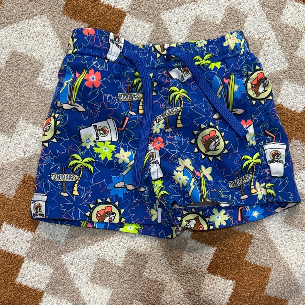 Buc-ee’s Vibrant Blue Kids Swim Trunks with Fun Print